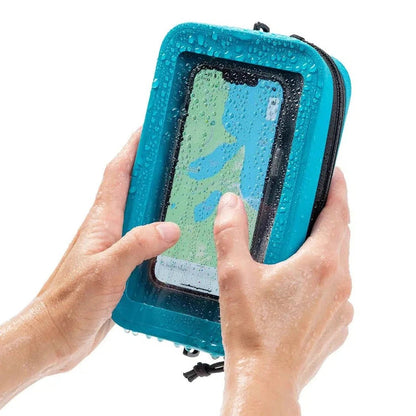 A person holding the black Nite Ize RunOff Waterproof Hip Pack with a phone inside, showing water droplets on the pack.