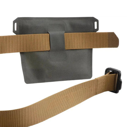 A charcoal Nite Ize RunOff Waterproof Pocket with tan straps and a black buckle, shown from a front angle against a white background.