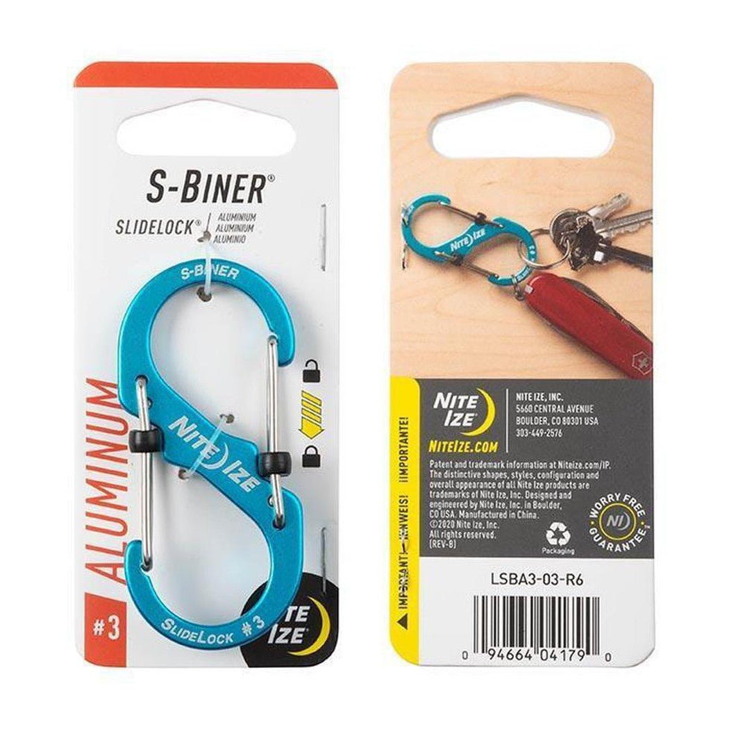 A front and back view of the Nite Ize S-Biner Slidelock Aluminum #3 carabiner in blue, showing the product and a keyring attachment on a wooden background.