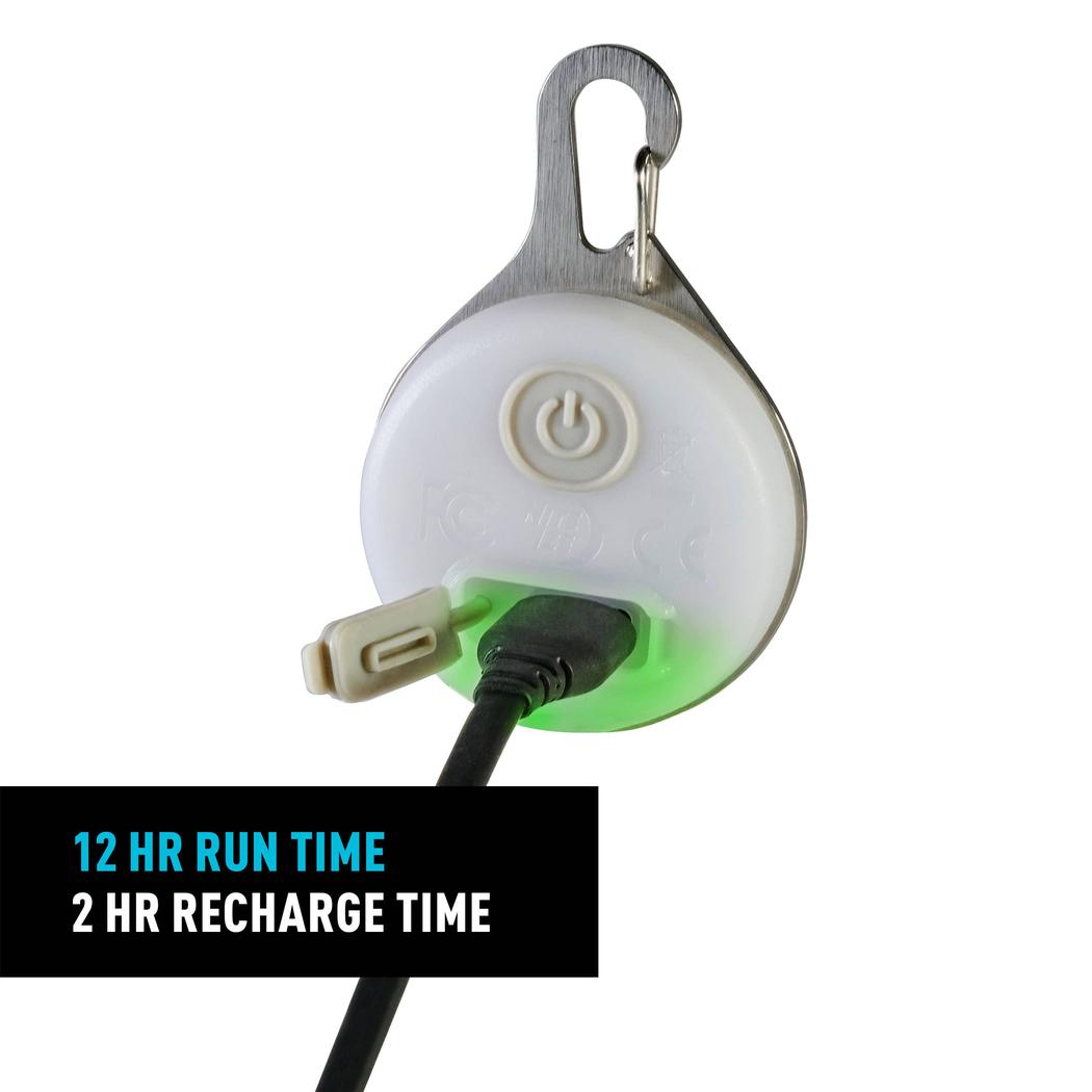 A close-up of the Nite Ize SpotLit Splash Waterproof Rechargeable Collar Light - Disc-O Select with a USB cable plugged in, showing the 12 hr run time and 2 hr recharge time text.