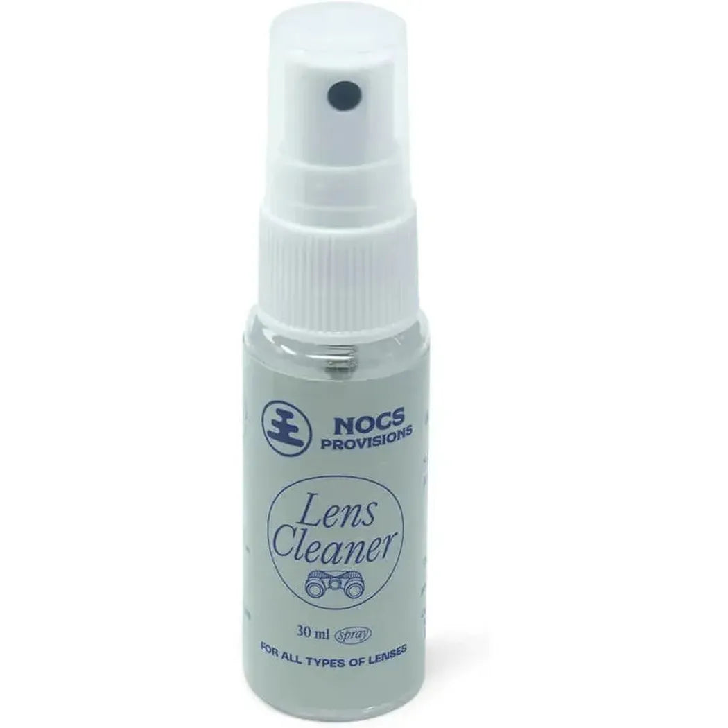 A front view of a small white spray bottle of Nocs Provisions Lens Cleaner with a white background.