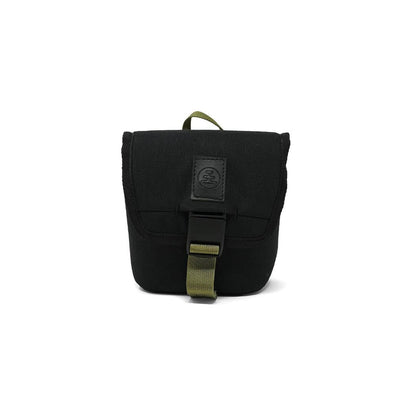 A front view of the Nocs Provisions Field Issue 32 Pouch in Charcoal showing the buckle closure and green strap against a white background.