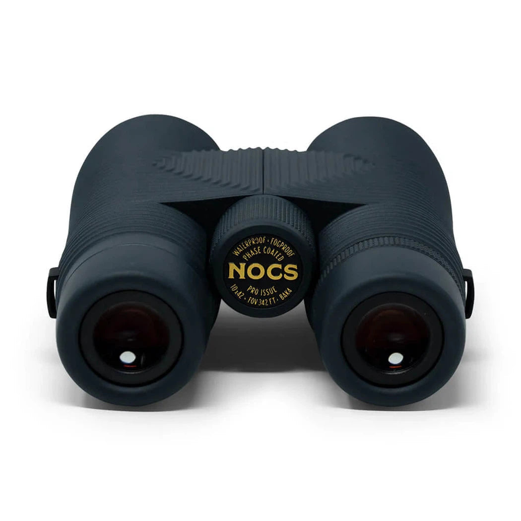 Back view of the Nocs Provisions Pro Issue Waterproof Binoculars in Harbor Blue showing the central focus wheel and dark lenses against a white background.