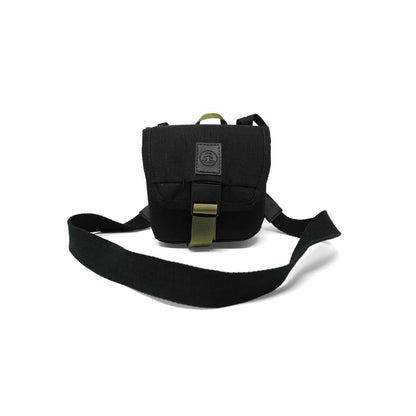 A black Nocs Provisions Standard Issue Pouch with a shoulder strap and buckle, photographed against a white background.