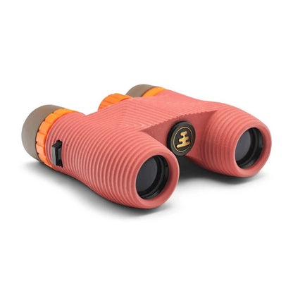 Side view of the Nocs Provisions Standard Issue Waterproof Binoculars in Cypress showing the textured grip and orange accents against a white background.