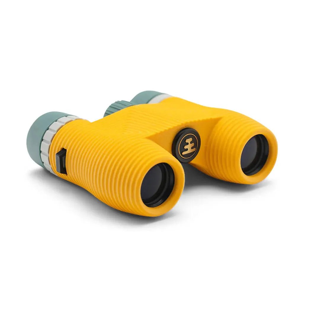 A front view of the Nocs Provisions Standard Issue Waterproof Binoculars in Cypress with a white background.