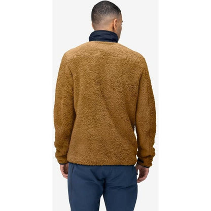 Back view of the Norrona Men's Femund Warm3 Jacket in Camelflage on a model wearing dark blue pants against a white background.