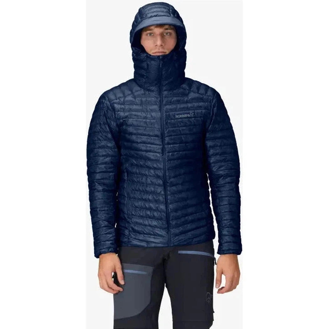 A front view of the Norrona Men's Trollveggen Superlight Down800 Hood in Indigo Night on a model against a white background.