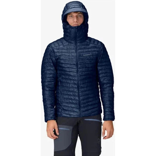 A front view of the Norrona Men's Trollveggen Superlight Down800 Hood in Indigo Night on a model against a white background.