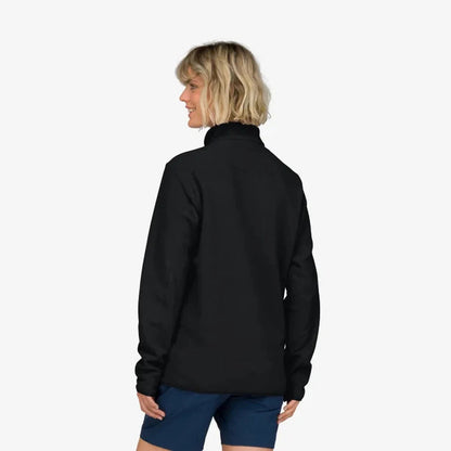 Back view of the Norrona Unisex Femund Warm 2 Halfzip in Caviar Black on a model wearing blue shorts against a white background.