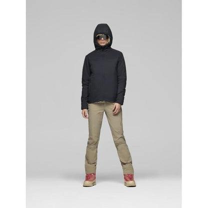 A model wearing the Norrona Women's Femund Thermo60 Zip Hood in Caviar Black stands against a light gray background.