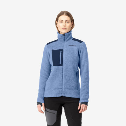 A front view of the Norrona Women's Trollveggen Thermal Pro Jacket in Infinity color on a model wearing black pants with a gray pocket patch against a plain white background.