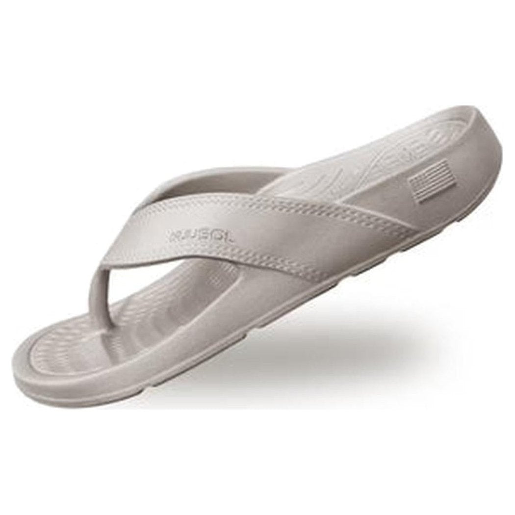 Side view of the NuuSol Womens Cascade Flip Flop in Driftwood showing the textured footbed and stitching against a white background.