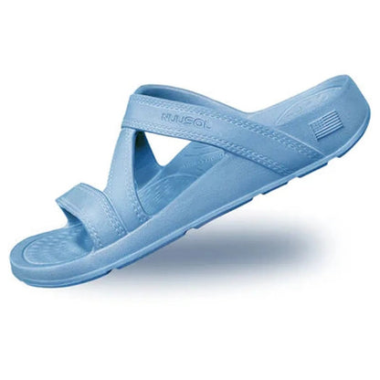 Side view of the NuuSol Women's Hailey Slide in Blue Horizon showing the crisscross strap design against a white background.