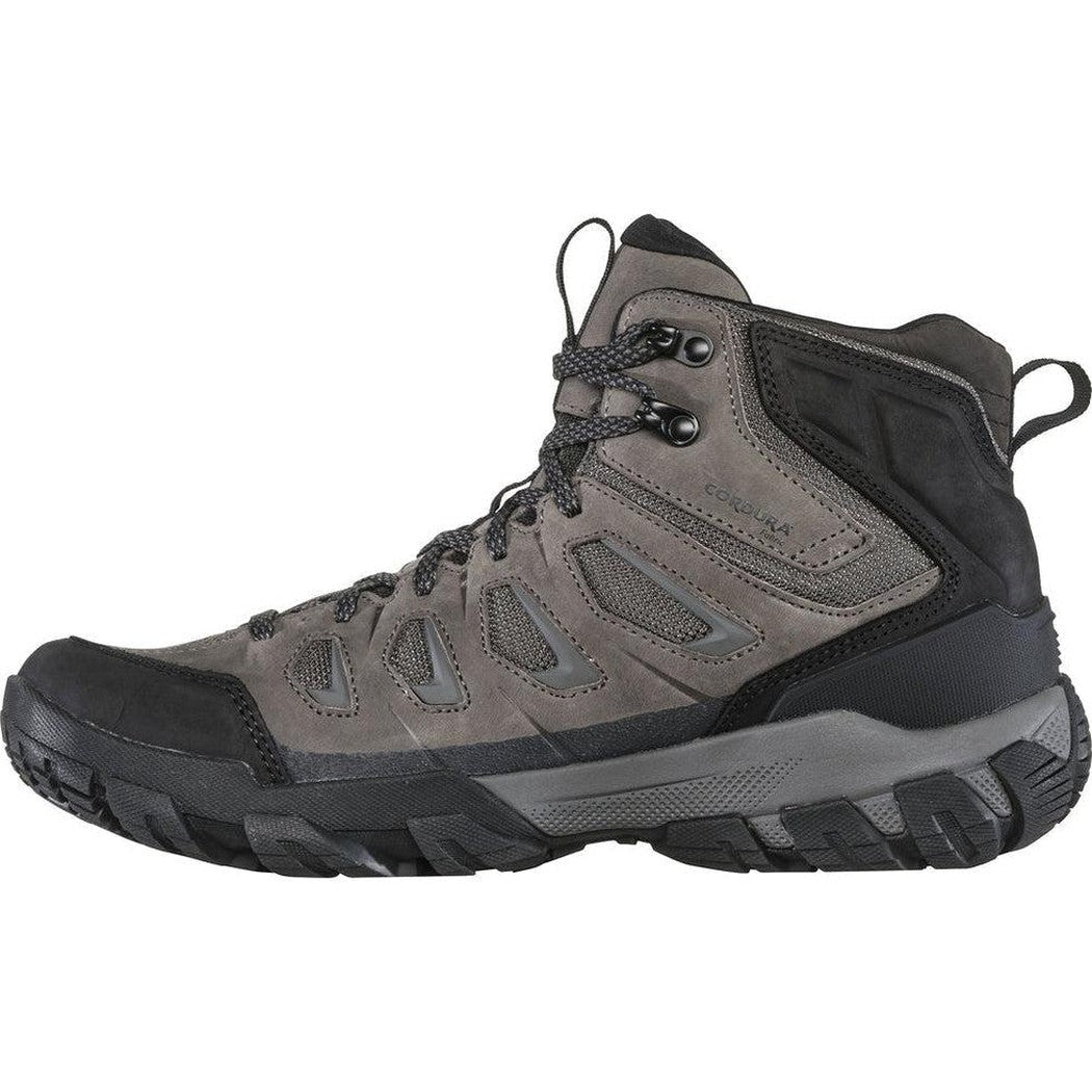 Side view of the Oboz Men's Sawtooth X Mid B-Dry in Charcoal showing the lugged outsole against a white background.