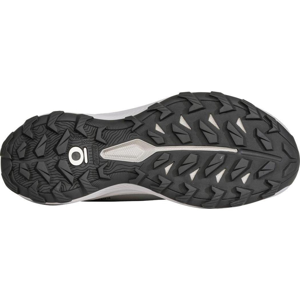 The sole of the Oboz Women's Katabatic LT Low GTX Waterproof shoe in Drizzle is shown from above, displaying the lugged tread pattern and a white midsole accent.