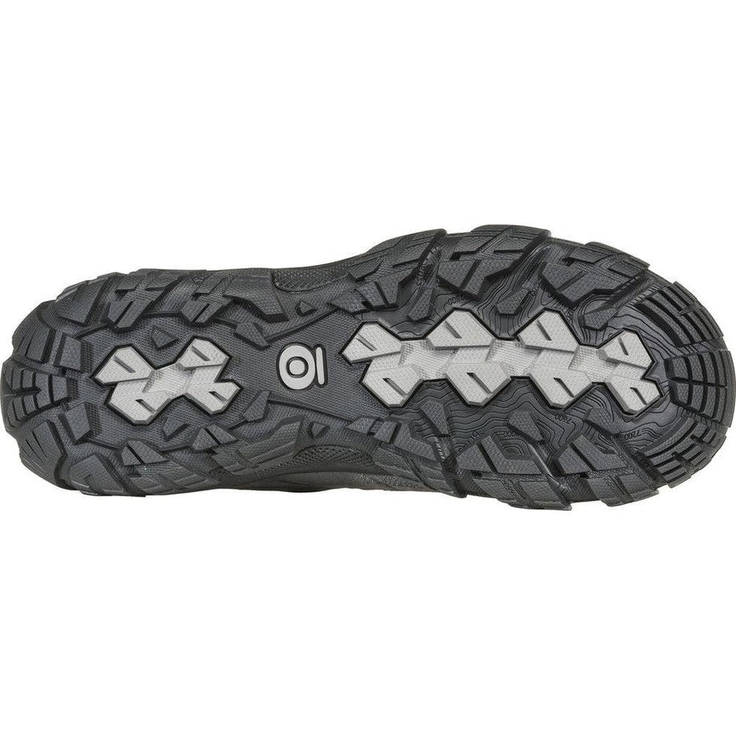 The sole of the Oboz Women's Sawtooth X Low B-Dry in Hazy Gray is shown from below, displaying the lugged tread pattern against a white background.