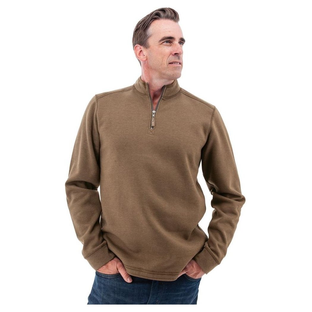 A man wearing the Old Ranch Men's Ozark 1/4 Zip Pullover in Teak stands with hands in pockets against a white background.