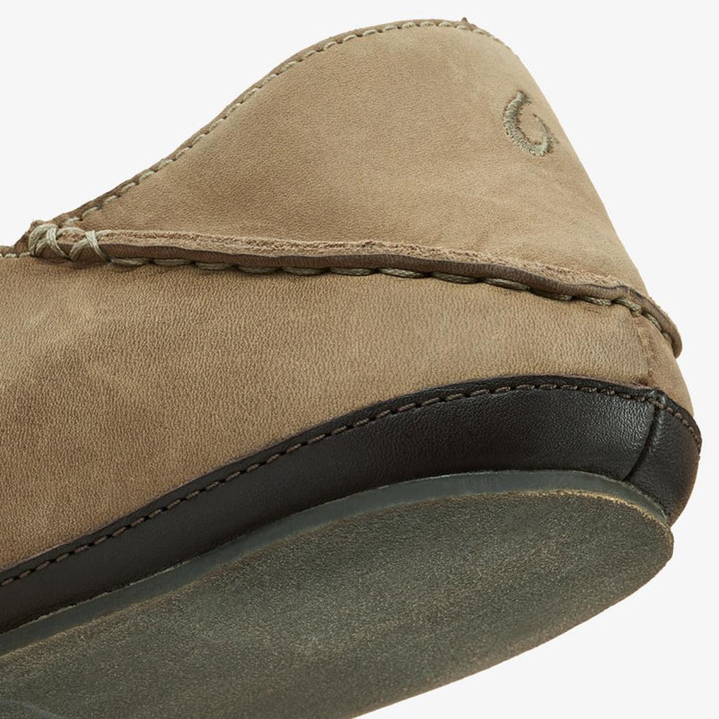 A close-up of the Olukai Men's Moloa Slipper in Clay/Dark Java showing the stitched upper and dark rubber outsole against a white background.