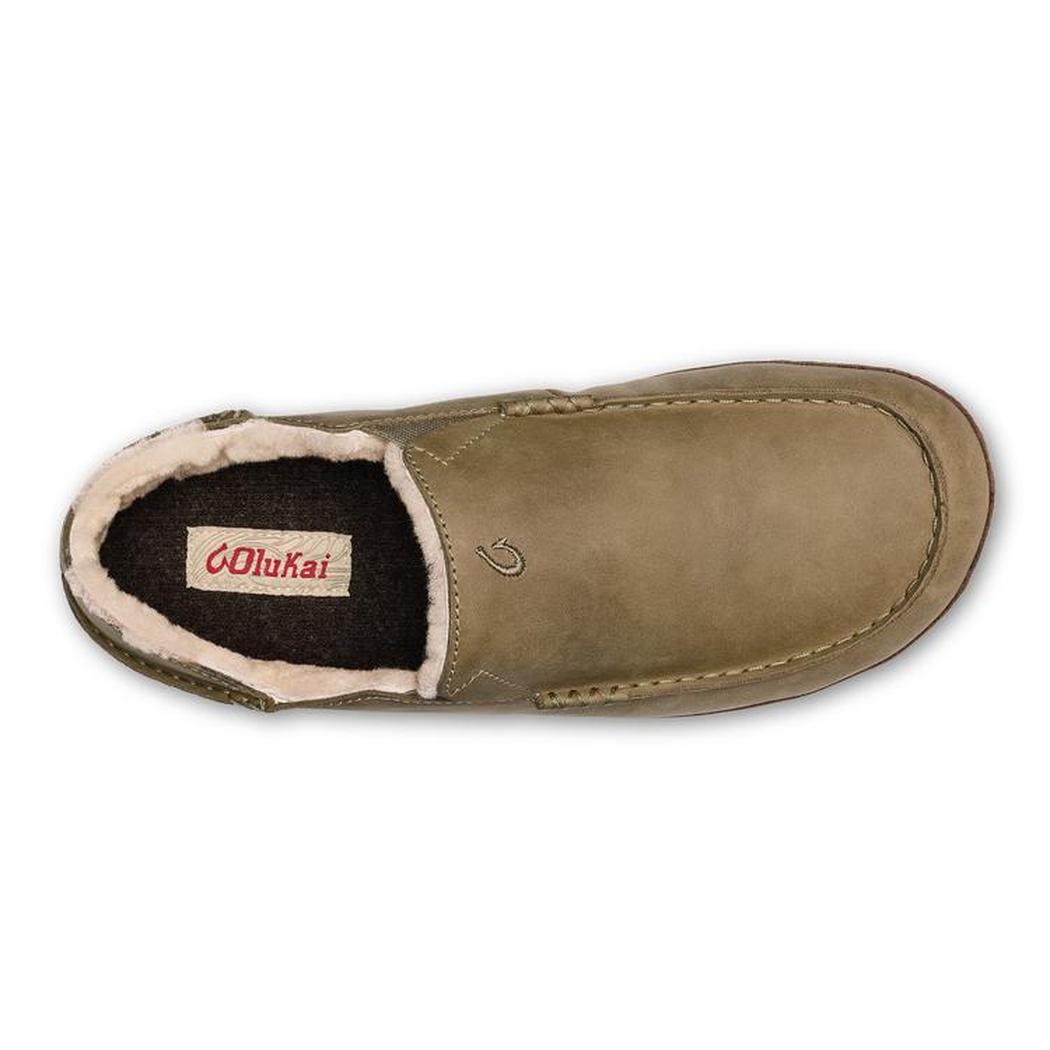 A top-down view of the Olukai Men's Moloa Slipper in Clay/Dark Java showing the brand label and soft lining inside.