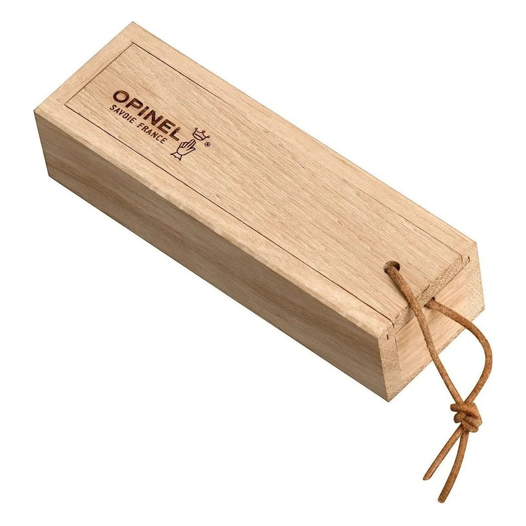 A side view of the Opinel No.08 Ellipse Ebony Folding Knife in a natural wood box with a brown cord closure against a white background.