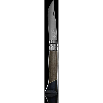 A side view of the Opinel No.08 Workshop knife with a charcoal/graphite handle and silver accents against a black background.