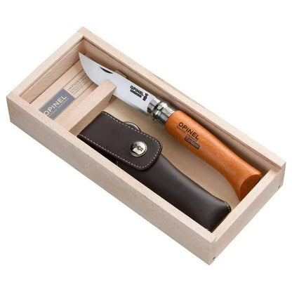 A top-down view of the Opinel No.8 Carbon & Sheath Gift Box with the knife and sheath inside the wooden box.