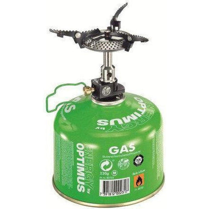A green Optimus Crux Lite camping stove with a black burner top, viewed from the front against a white background.