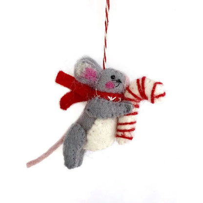 A felt mouse ornament with a red scarf and candy cane hangs from a red and white string against a white background.