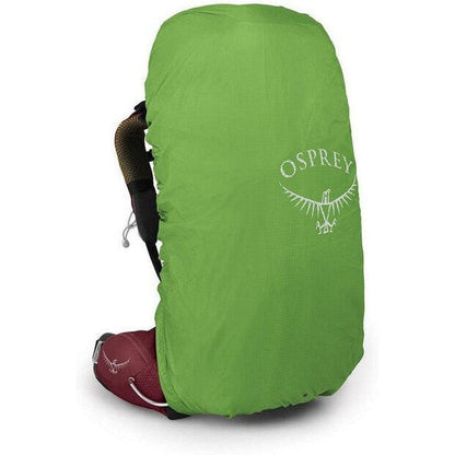 Side view of the Osprey Aura AG 50 in Berry Sorbet Red with a green rain cover, showing the backpack straps and a white background.