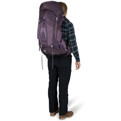 Back view of the Osprey Aura AG 50 in Berry Sorbet Red on a model wearing a plaid shirt against a white background.