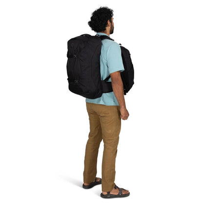 Back view of the Osprey Farpoint 55 Black backpack on a model against a white background.