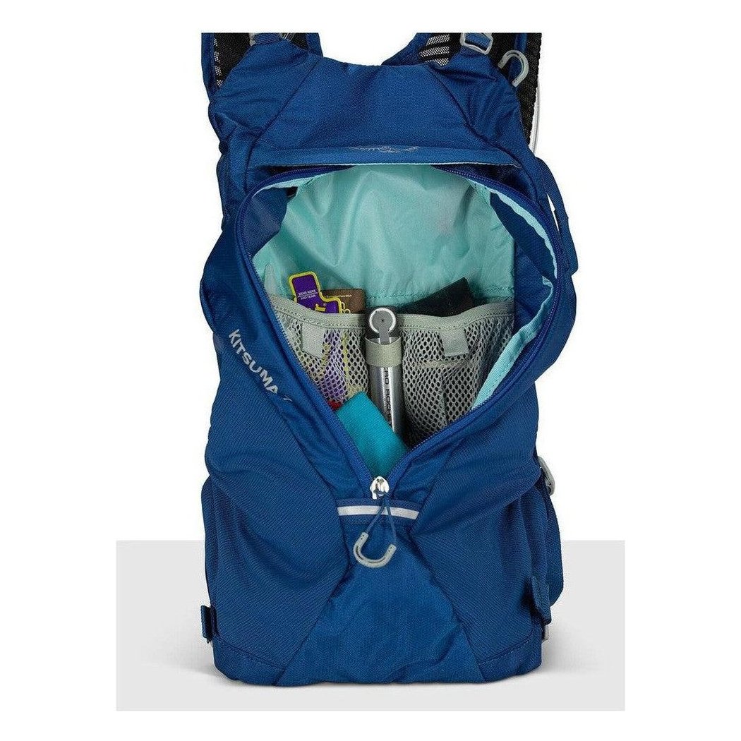 A front view of the Osprey Kitsuma 7 hydration pack in SpaceTravelGrey showing the main compartment with a water bottle and other items inside.