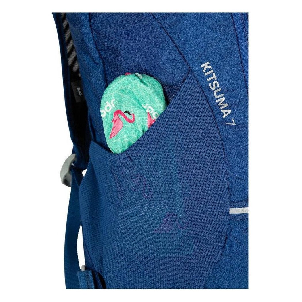 A close-up of the Osprey Kitsuma 7 in SpaceTravelGrey showing a pocket with a green flamingo item.