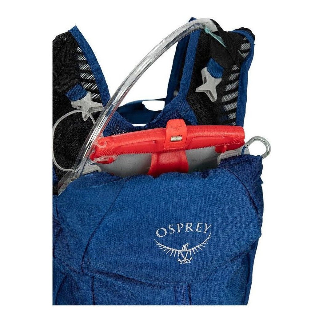 A close-up of the Osprey Kitsuma 7 hydration pack in SpaceTravelGrey, showing the front pocket and red water reservoir against a white background.
