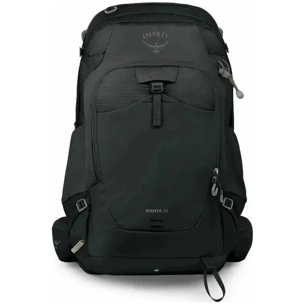 Back view of the Osprey Manta 34 hiking hydration backpack in dark charcoal with a front zippered pocket and side straps.