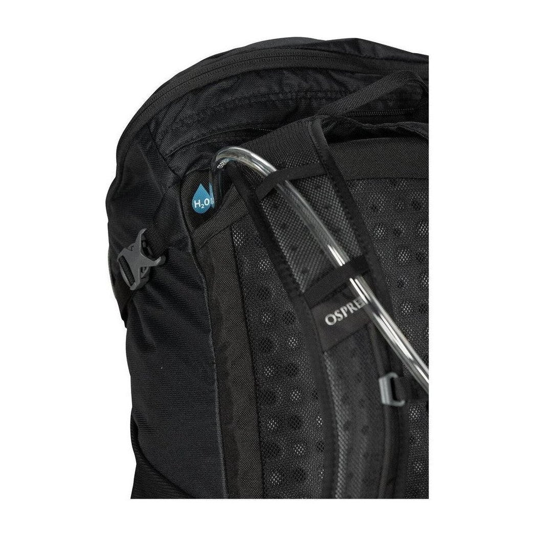 Close-up of the black Osprey Skarab 22 backpack showing the hydration tube and mesh panel.