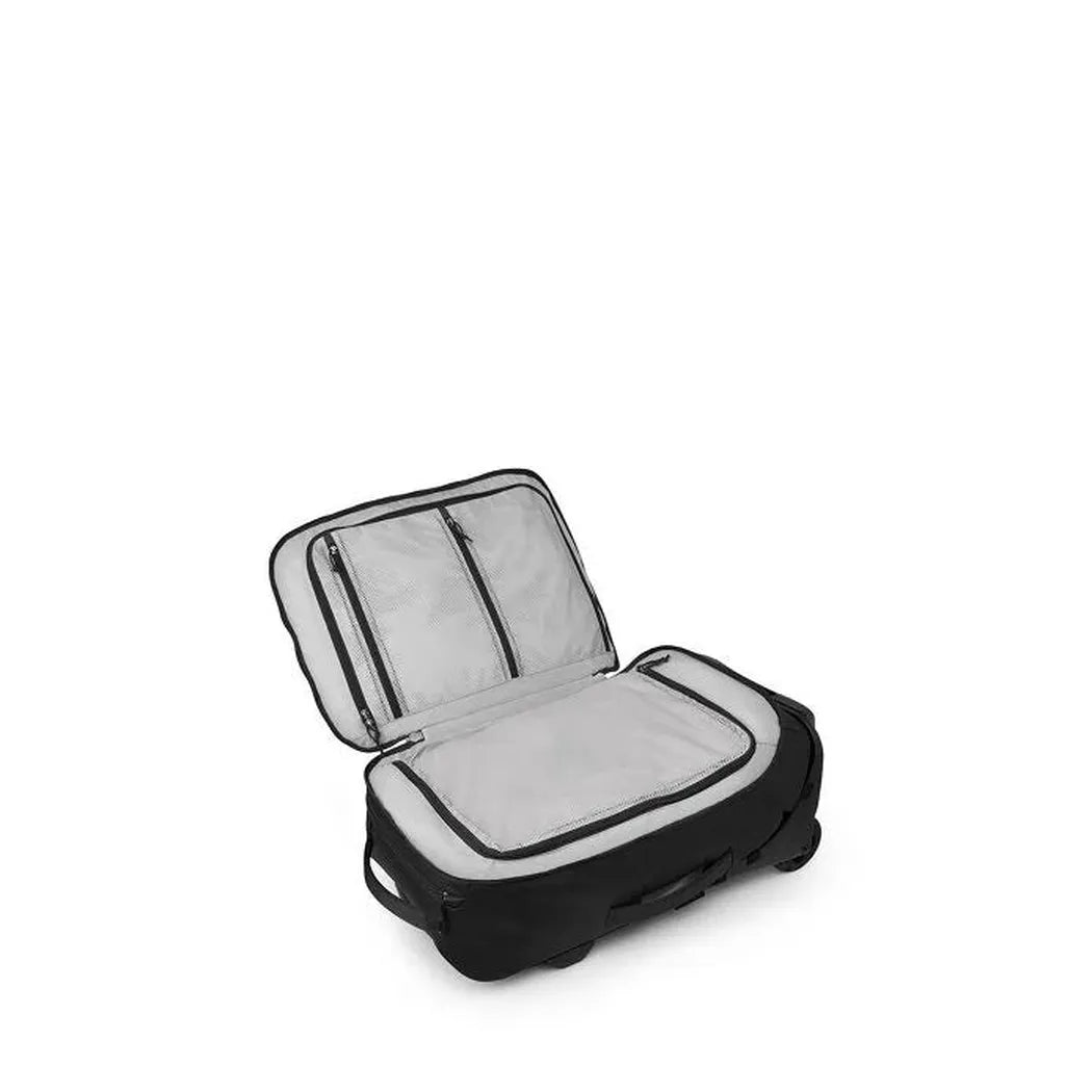 An open Osprey Transporter Wheeled Carry On in Raven Black sits against a white background.