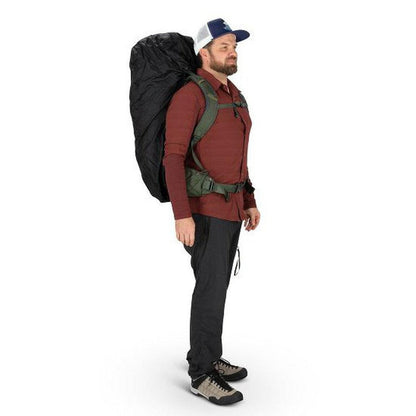 Side view of the Osprey UltraLight Raincover - Medium in Black on a model with a white background.