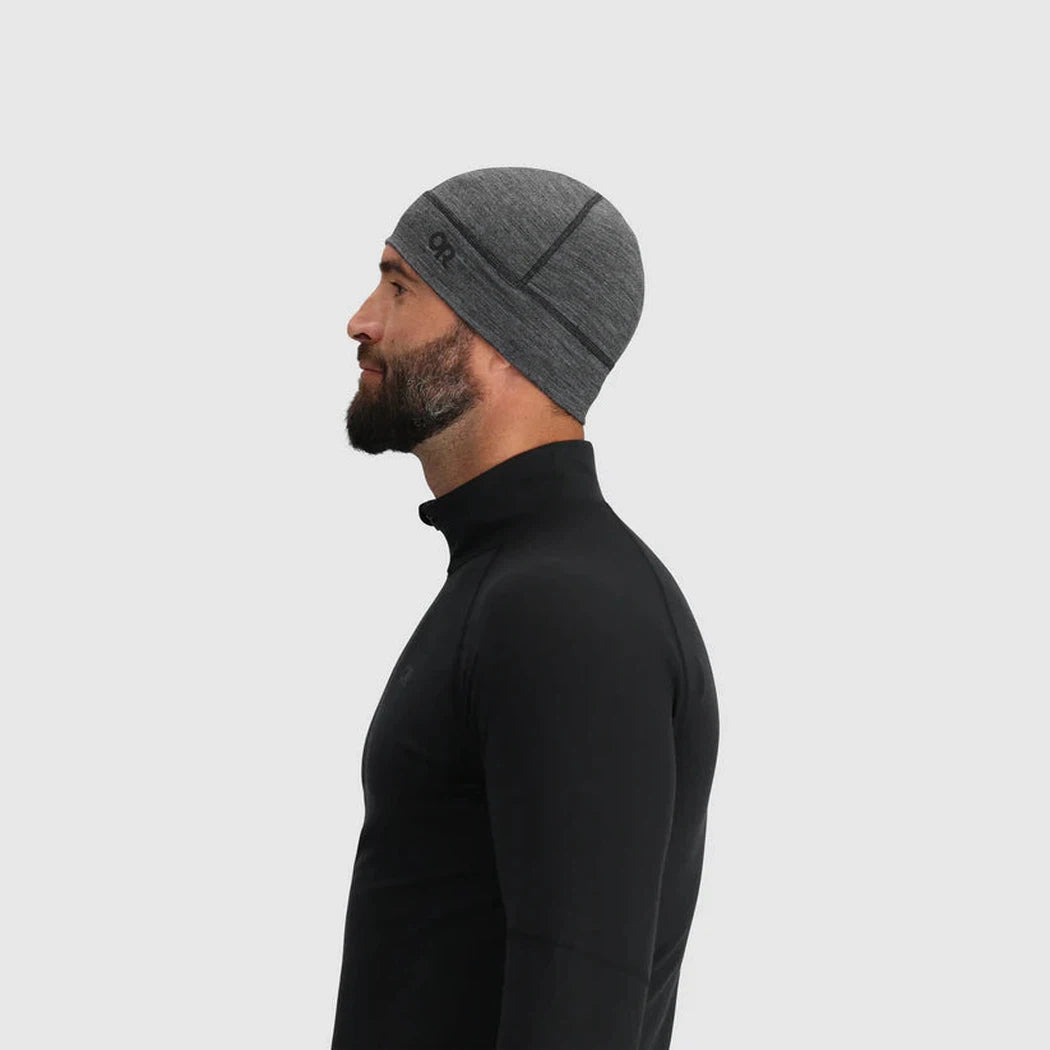 Side view of the Outdoor Research Alpine Onset Merino 150 Beanie in Black on a model against a plain white background.