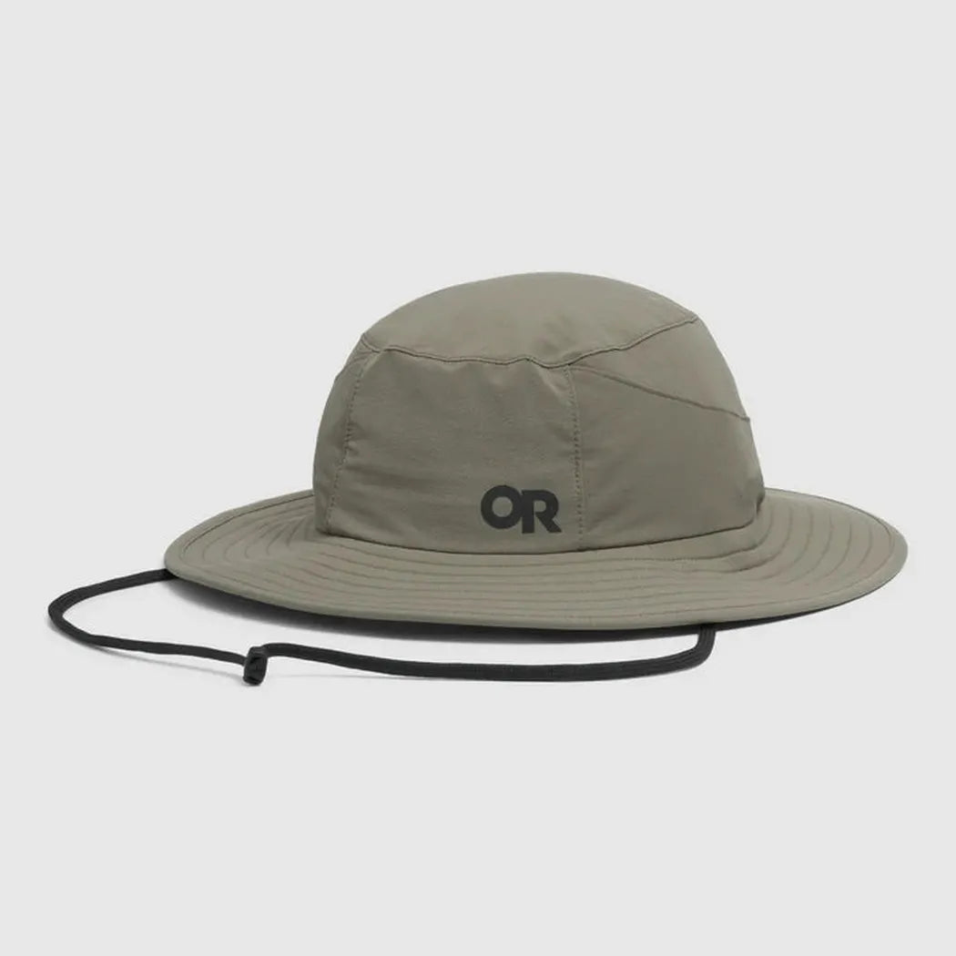 A front view of the Outdoor Research Helios Sun Hat in Light Pewter with a black chin strap against a white background.