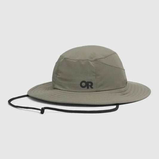 A front view of the Outdoor Research Helios Sun Hat in Light Pewter with a black chin strap against a white background.