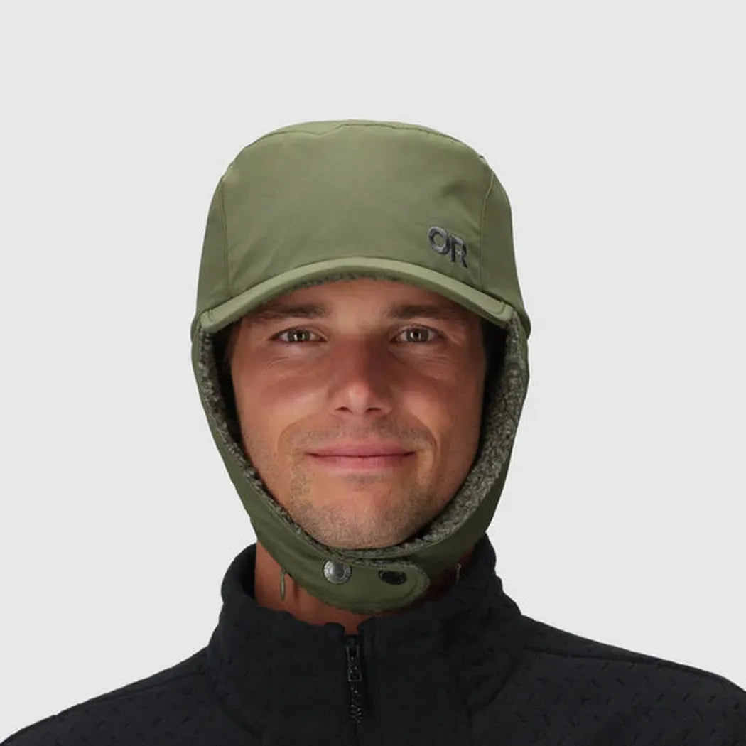 A front view of the Outdoor Research Whitefish Hat in Atlantic color on a model wearing a dark zip-up jacket against a plain background.