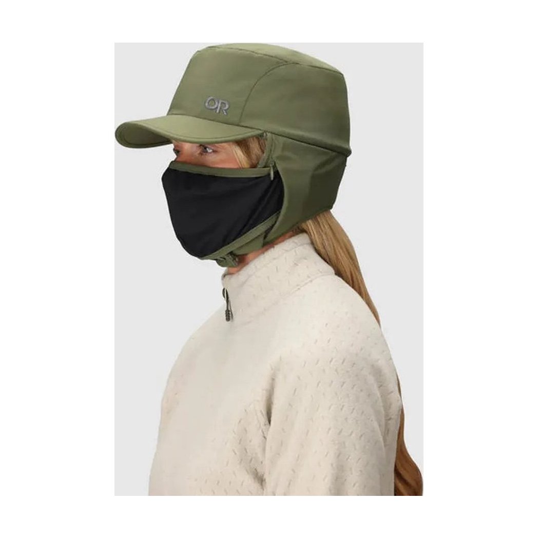 Side view of the Outdoor Research Whitefish Hat in Atlantic showing the face covering feature on a model against a light background.