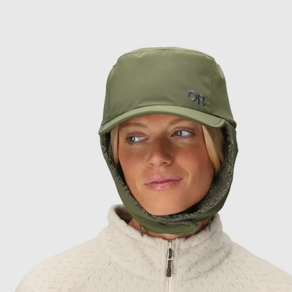 A front view of the Outdoor Research Whitefish Hat in Atlantic on a model wearing a light-colored zip-up sweater against a plain background.