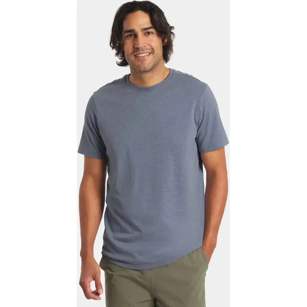 A model wearing the Paka Apparel Mens Essential Tee in Black stands against a plain white background.