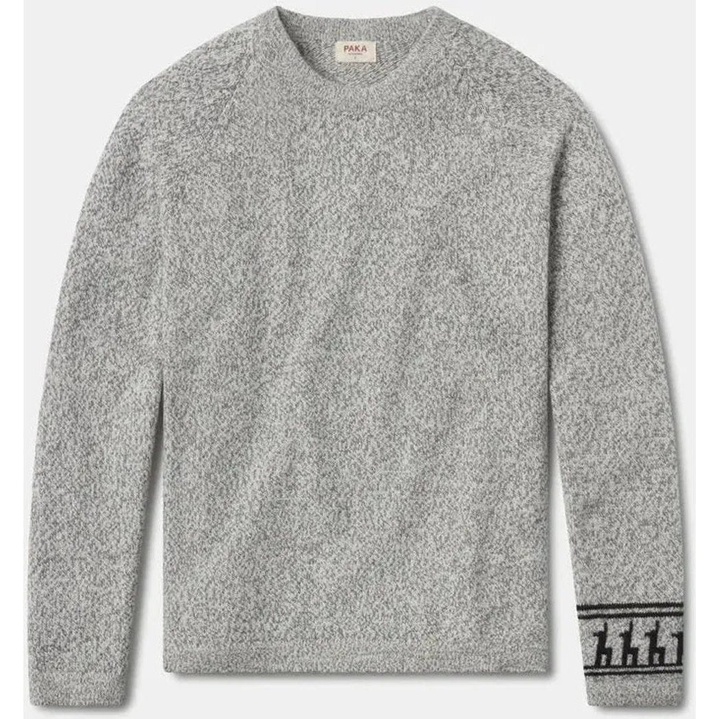 A front view of the Paka Apparel The Costa light grey sweater with a graphic on the cuff against a white background.