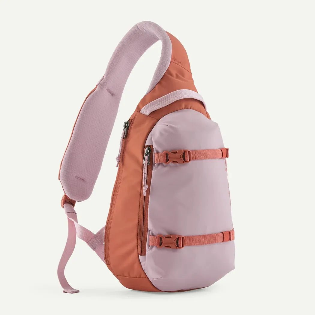 Side view of the Patagonia Atom Sling 8L in Black showing the adjustable straps and white background.