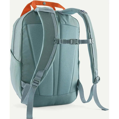 Back view of the Patagonia Atom Tote Pack 20L in Blue Sage showing padded shoulder straps and a white background.