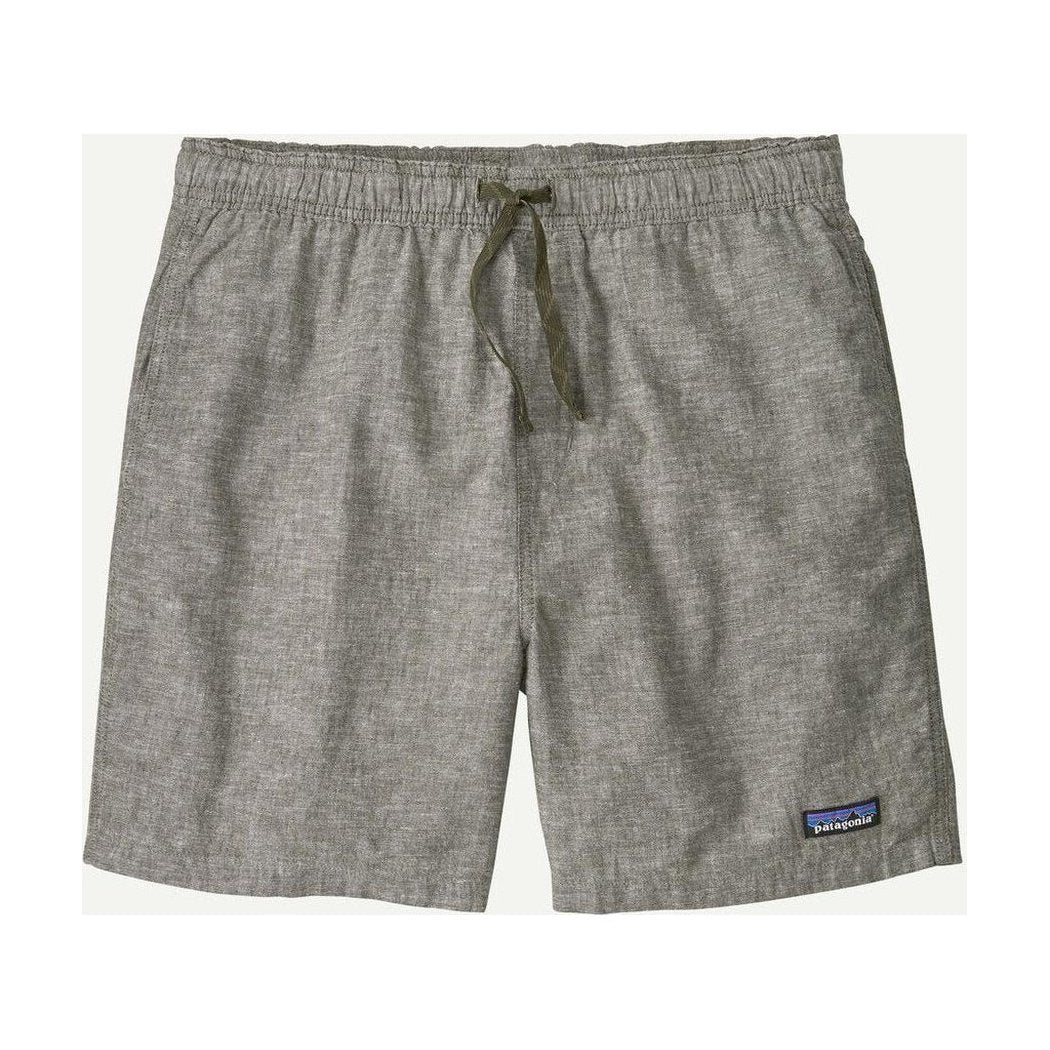 Side view of the Patagonia Men's Baggies Naturals in Feather Grey showing the drawstring waist and small logo patch on the lower right leg.